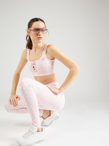 Skinny Pantalon de sport 'LOGOMANIA' GUESS en rose