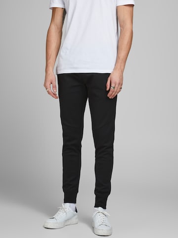 JACK & JONES Tapered Housut 'Will' värissä musta: edessä