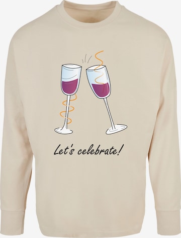 T-Shirt 'Lets Celebrate' Merchcode en beige : devant