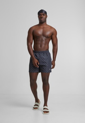 Karl Kani Plavky 'KM251-041-1 Signature Monogram Aop' - Modrá