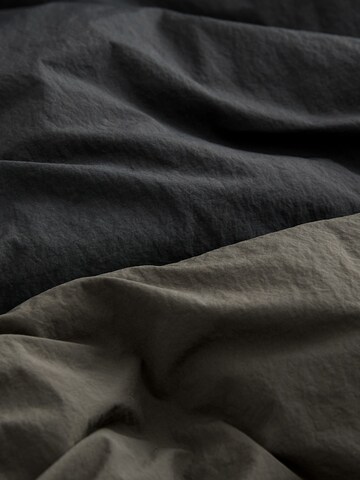 Next - Abrigo en gris