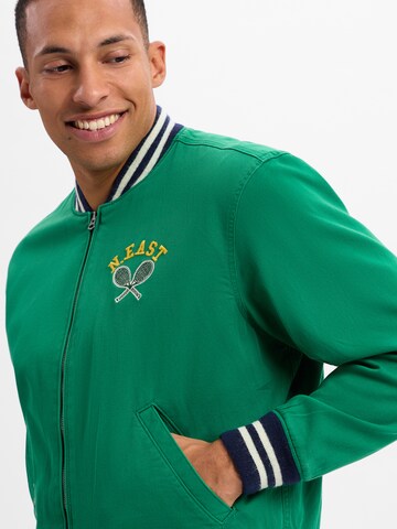 Polo Ralph Lauren Übergangsjacke 'VARSITY' in Grün