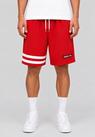 Unfair Athletics Regular Trousers 'DMWU' in Red: front