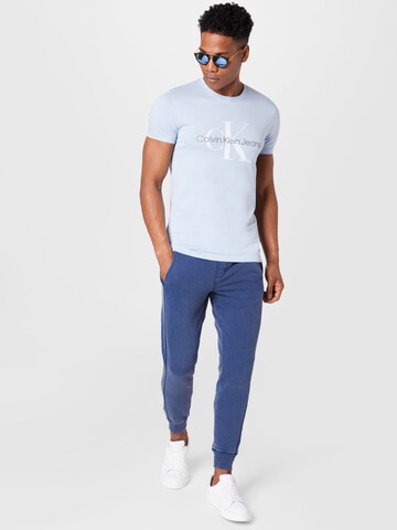 Calvin Klein Jeans Tapered Hose in Blau