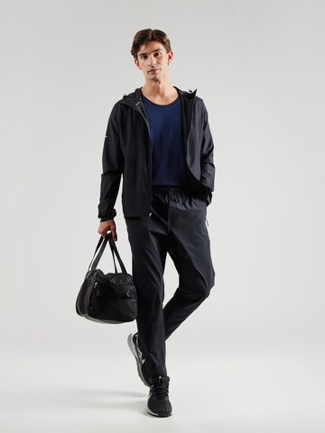 Effilé Pantalon de sport 'Unlimited' NIKE en noir