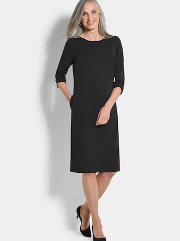 Goldner Etuikleid in Schwarz