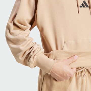ADIDAS SPORTSWEAR Sports sweatshirt 'Essentials Feelcozy' in Brown