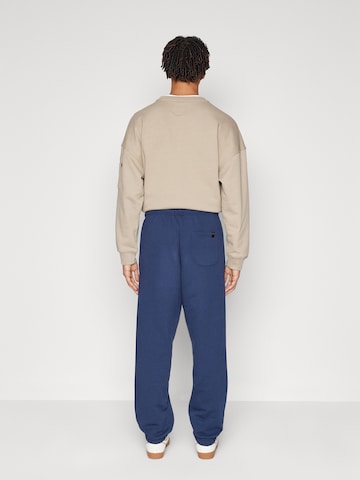 ALPHA INDUSTRIES Tapered Trousers 'Essentials' in Blue