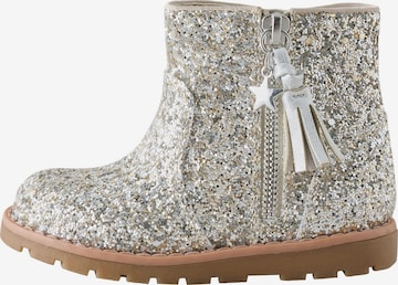Next - Botas en plata: frente