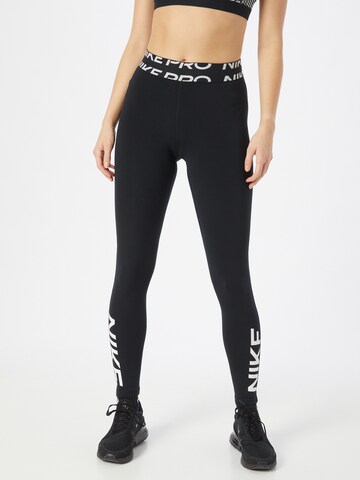 NIKE Skinny Sportbroek in Zwart: voorkant