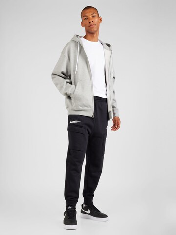 Veste de survêtement 'Solo Swoosh' Nike Sportswear en gris