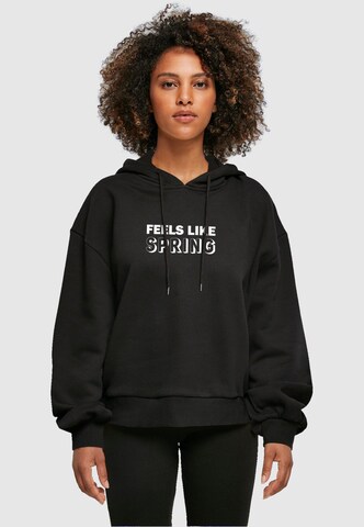 Merchcode Sweatshirt 'Spring - Feels like' in Schwarz: Vorderseite