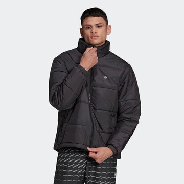 ADIDAS ORIGINALS Winter jacket in Black: front