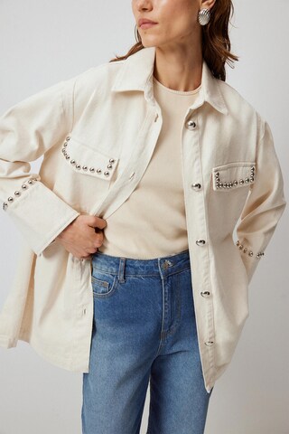 Touche Prive Tussenjas in Beige
