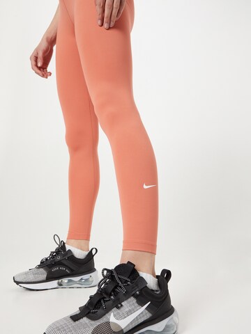 NIKE Skinny Športové nohavice 'One' - oranžová