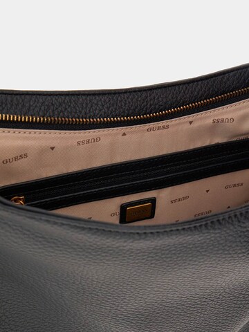 GUESS Schultertasche 'Camden' in Schwarz