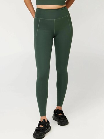Girlfriend Collective Skinny Sportovní kalhoty ' Compressive ' – zelená: přední strana