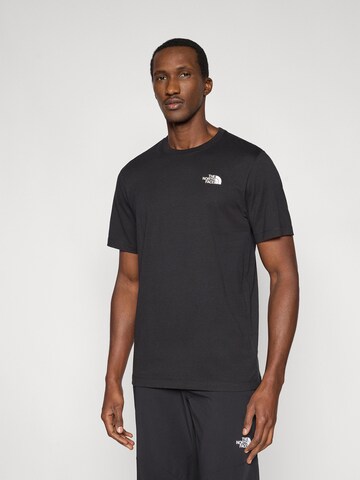 Tricou 'BOX NSE CELEBRATION' de la THE NORTH FACE pe negru