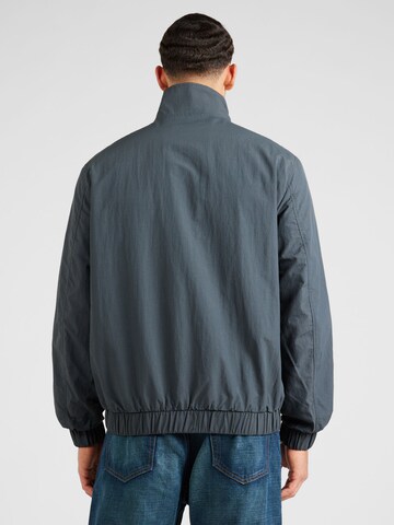Tommy Jeans Демисезонная куртка 'Essential' в Серый
