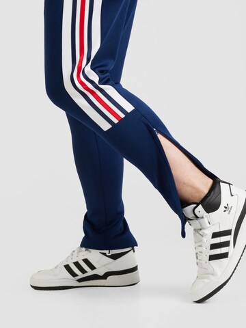 ADIDAS SPORTSWEAR Tapered Workout Pants 'House Of Tiro Nations Pack' in Blue
