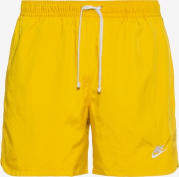 Nike Sportswear - Calças 'Essentials' em amarelo: frente