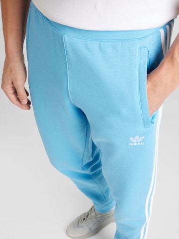 Tapered Pantaloni de la ADIDAS ORIGINALS pe albastru