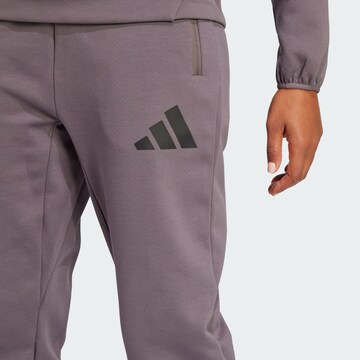 Tapered Pantaloni sportivi 'Z.N.E.' di ADIDAS SPORTSWEAR in grigio
