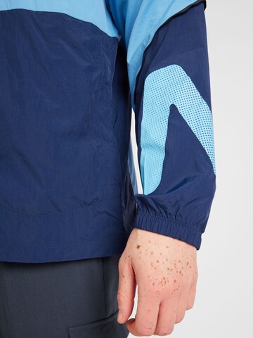 new balance - Chaqueta deportiva en azul