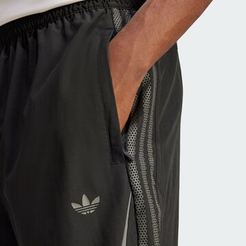 ADIDAS ORIGINALS Loose fit Pants 'Supernova' in Black