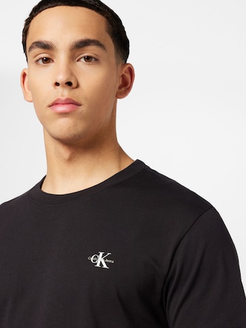 Calvin Klein Jeans T-Shirt in Schwarz | ABOUT YOU