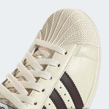 Baskets basses 'Superstar Lo Pro' ADIDAS ORIGINALS en blanc