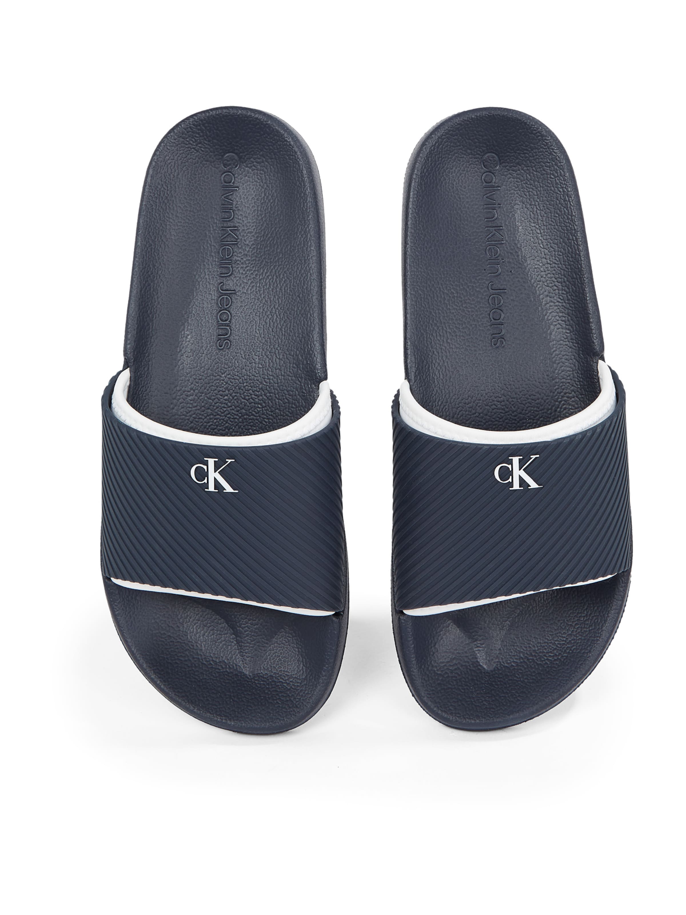 Saboți de la Calvin Klein pe albastru: spate