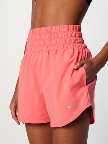 NIKE - regular Pantalón deportivo 'ONE' en naranja