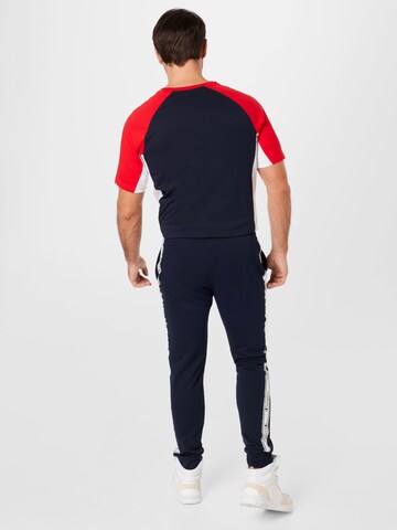 Champion Authentic Athletic Apparel Tapered Broek in Blauw