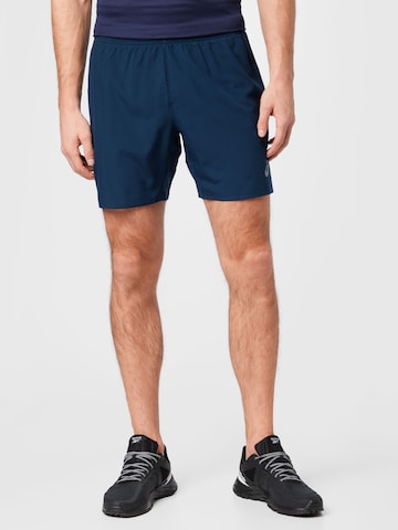 Regular Pantalon de sport ASICS en bleu : devant