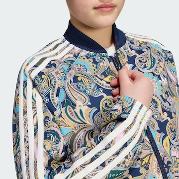 ADIDAS ORIGINALS - Chaqueta de entretiempo 'Sst' en azul