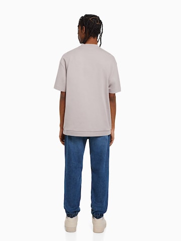 Bershka Tapered Jeans i blå