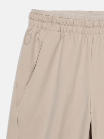 NIKE Loosefit Sporthose in Beige