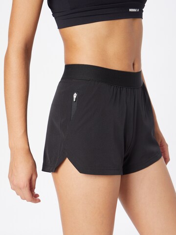 Regular Pantalon de sport Casall en noir