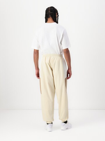 Nike Sportswear Baggy Kalhoty 'CLUB' – zelená