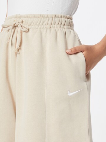 Nike Sportswear Široke hlačnice Hlače | bež barva