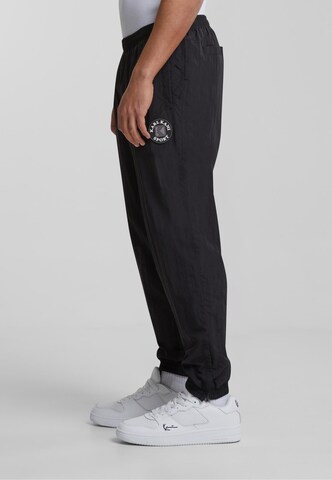 Effilé Pantalon de sport 'KM-PL074-001-01' Karl Kani en noir