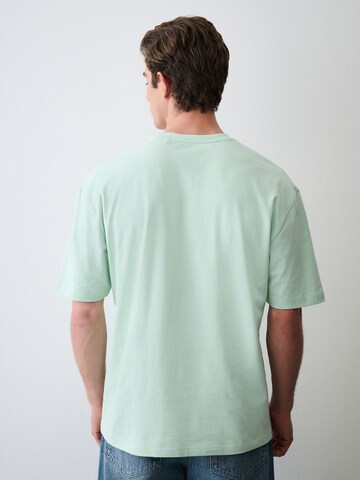 Tricou de la Next pe verde