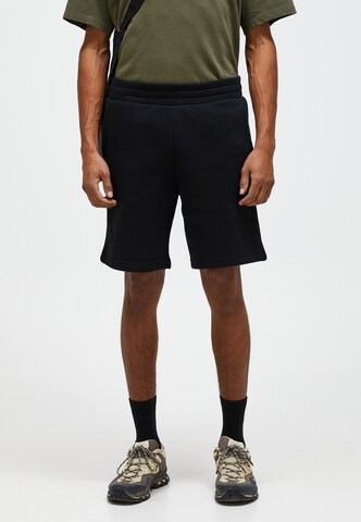 PEAK PERFORMANCE Regular Pants in Black: front