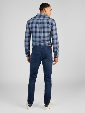 TOMMY HILFIGER Tapered Jeans 'Houston' in Blauw