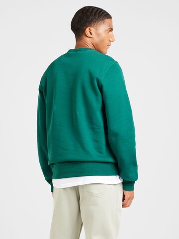 Felpa di Champion Authentic Athletic Apparel in verde