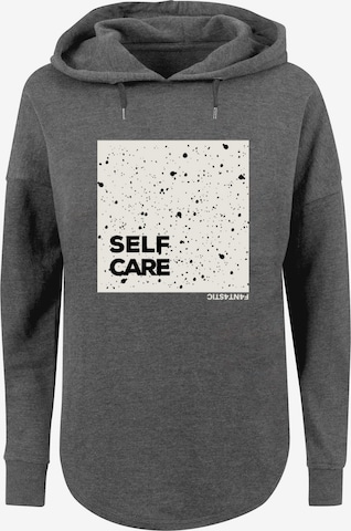 Sweat-shirt 'SELF CARE' F4NT4STIC en gris : devant