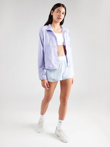 NIKE Štandardný strih Športové nohavice 'Swift' - Modrá