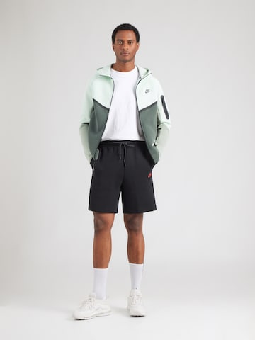 Nike Sportswear Ohlapna forma Hlače 'TECH FLC' | črna barva
