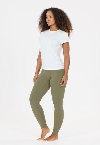 Athlecia Skinny Sports trousers 'Luxe V2' in Green